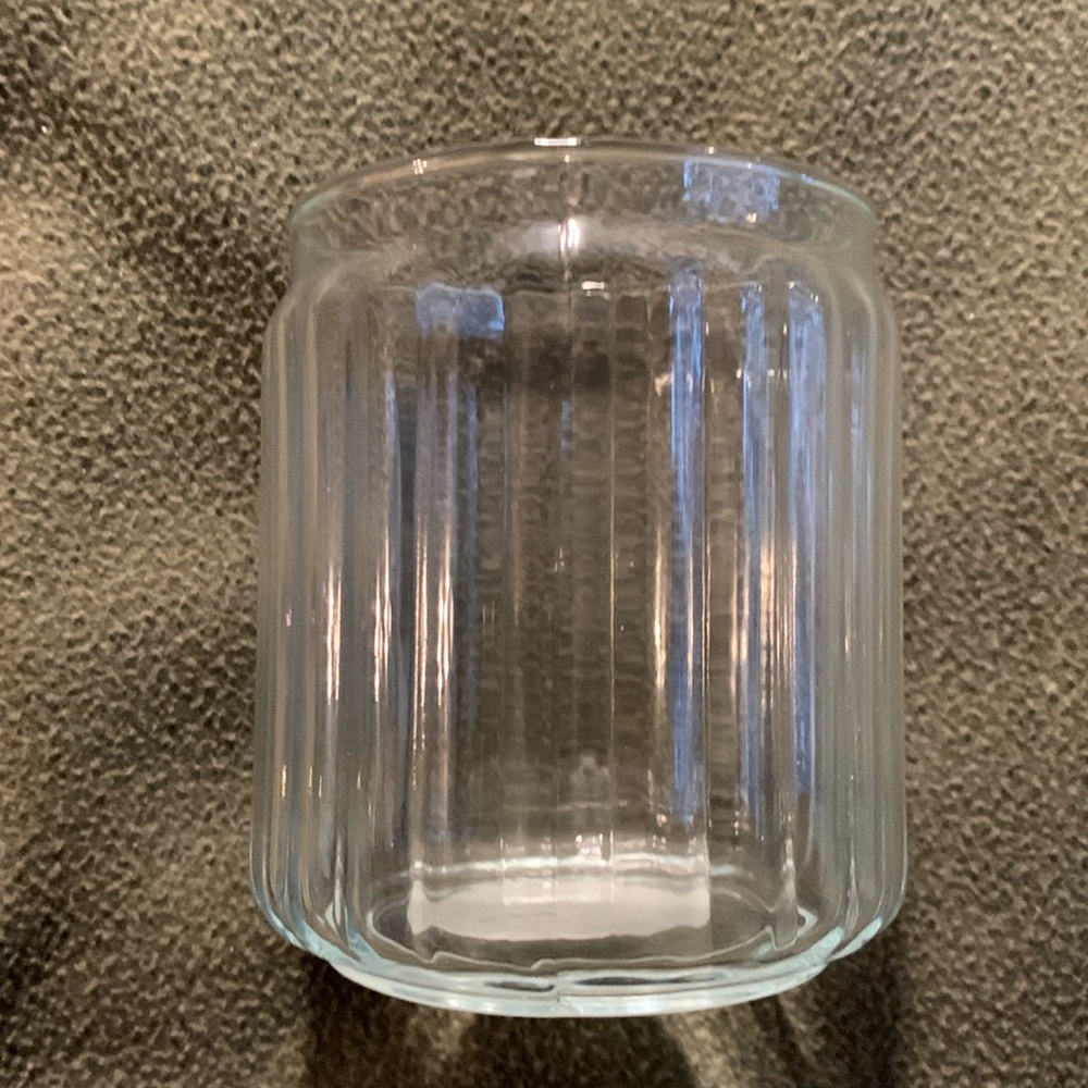 New Candle-lite ribbed glass candle holder.  Approximately 3 3/4” x 4 3/4”